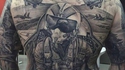 Tatouage : Devinons la passion du sujet ici présent...