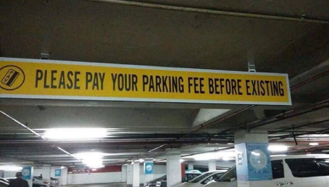 Dans le texte: "Merci de payer votre taxe de parking avant d'exister".
"Exiting": sortir.
"Existing": exister.
