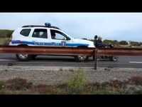 A police car pushes a electric wheelchair