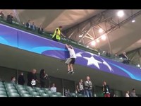 Legia Warsaw fan (Style Ninja) runs away after clashes after match vs BVB.  