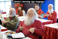 Pères Noël apprenant la langue des signes
