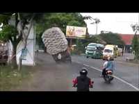 Car with a huge load overturned on street 