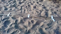 Un câble dans le sable