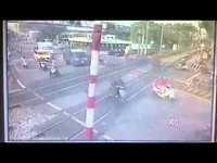 It was close. Failure of barrier rail at level crossing 
