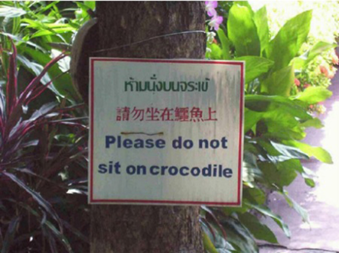 Un panneau placé à l'attention des personnes qui souhaiteraient s'attarder quelques temps sur le dos d'un crocodile.