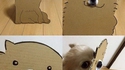 Qu'est-ce qui se cache derrière un chien en carton ?